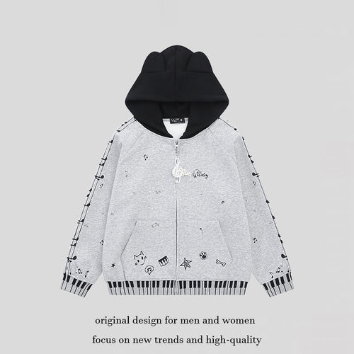Damen Kapuzensweatjacke mit durchgehendem Reißverschluss, Musikprint, Klaviertasten‑Bündchen und Ohrenkapuze Shop Nory