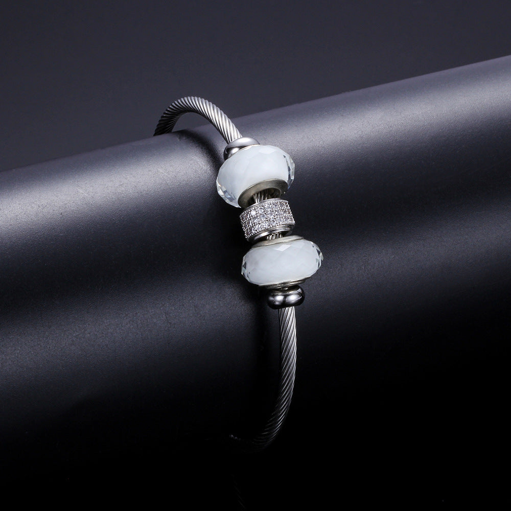 Damen Armband mit funkelnden Zirkonia und eleganten Glasdesign Shop Nory