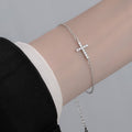 Damenarmband mit funkelndem Kreuzanhänger Shop Nory