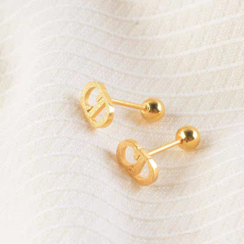 Damen elegante goldene Logo Steckerohrringe Shop Nory