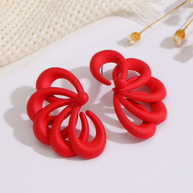 Damen Ohrringe mit kunstvollem, fluidem Design Shop Nory