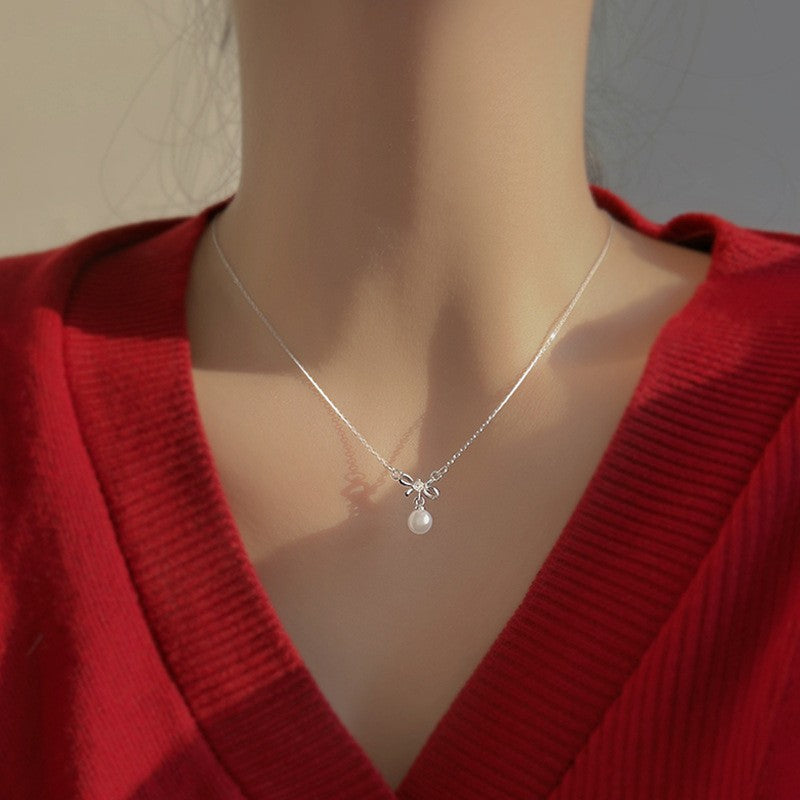 Damen Halskette mit eleganter Schleifen- und Perlenverzierung Shop Nory
