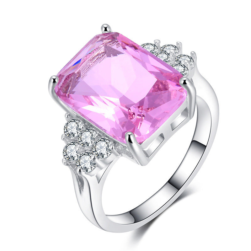 Damen luxuriöser Schmuckring mit rechteckigem pinkem Stein und funkelnden Zirkonia Shop Nory