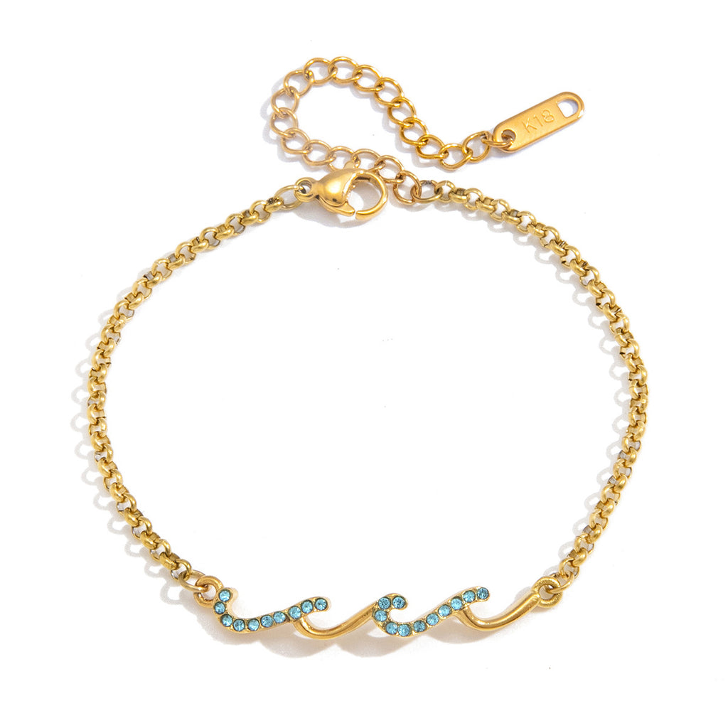 Damen Armband mit kunstvollem Wellen-Design und funkelnden Zirkonia-Elementen Shop Nory