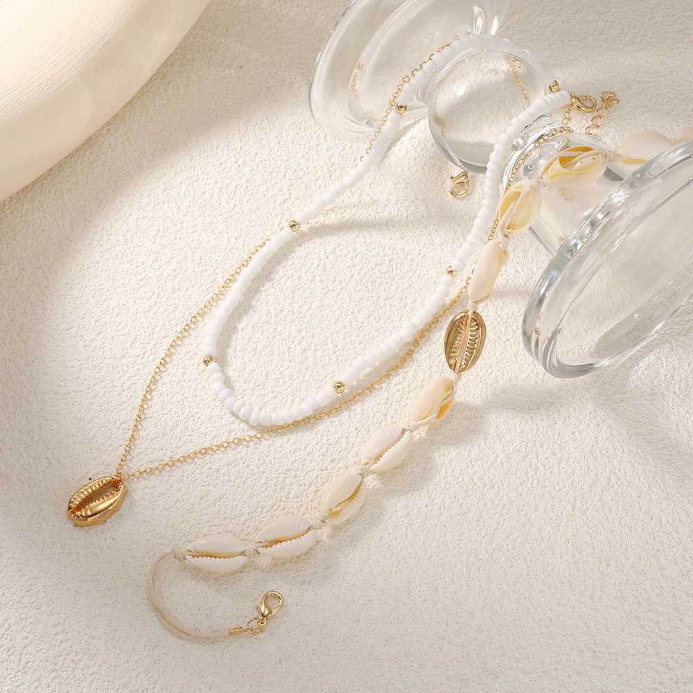 Damen mehrlagige Muschelkette mit goldenen Akzenten Shop Nory