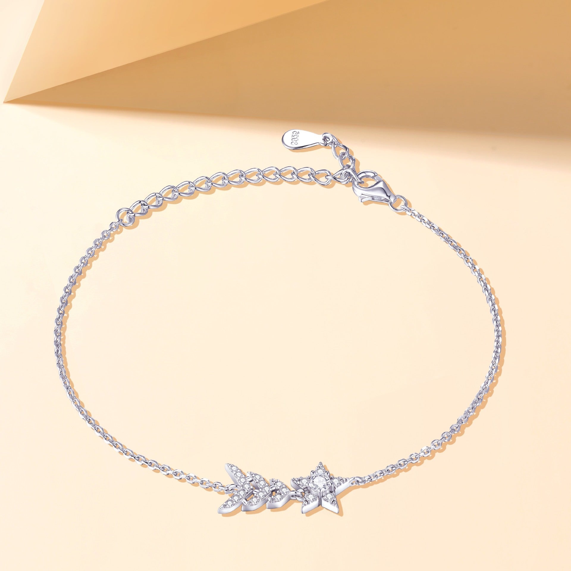 Damenarmband mit funkelnden Stern- und Blattmotiven Shop Nory