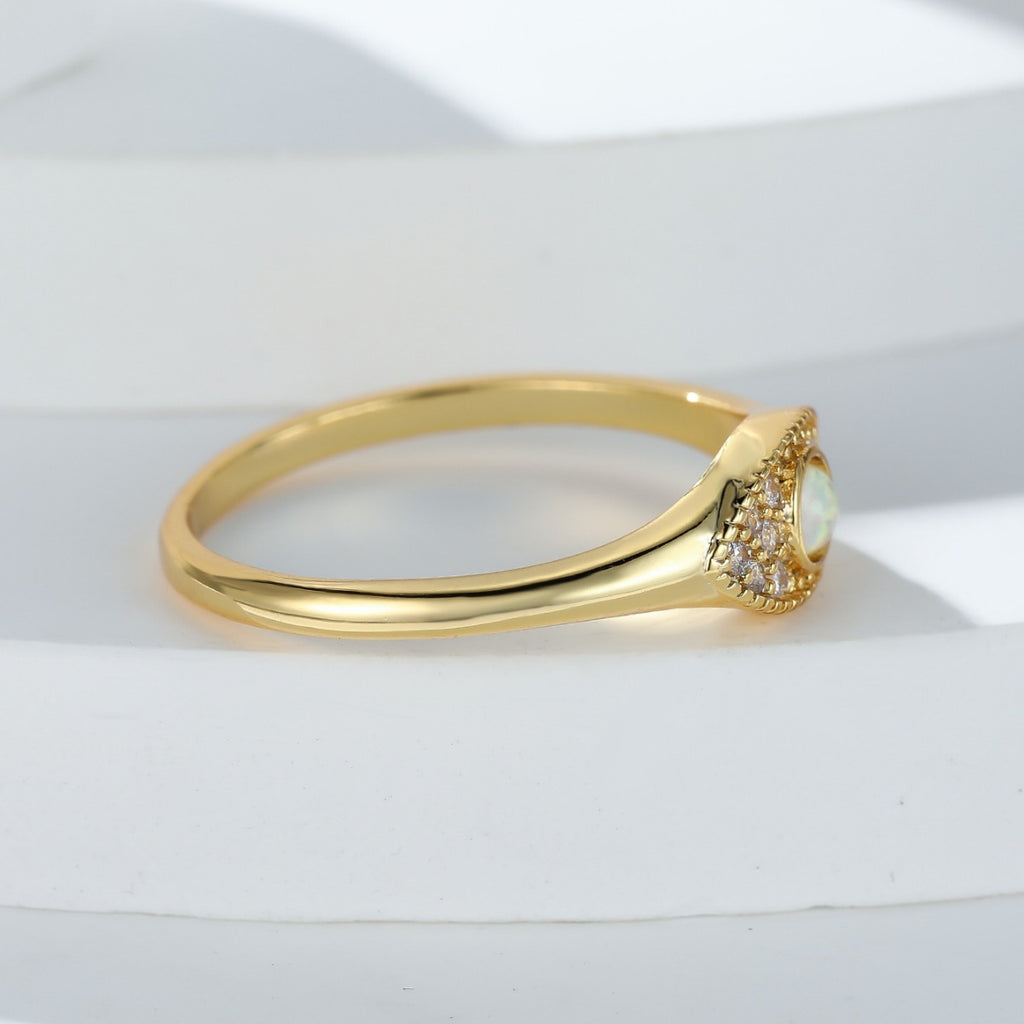 Damen Ring mit funkelndem Opal-Motiv und kunstvollen Zirkonia-Verzierungen Shop Nory