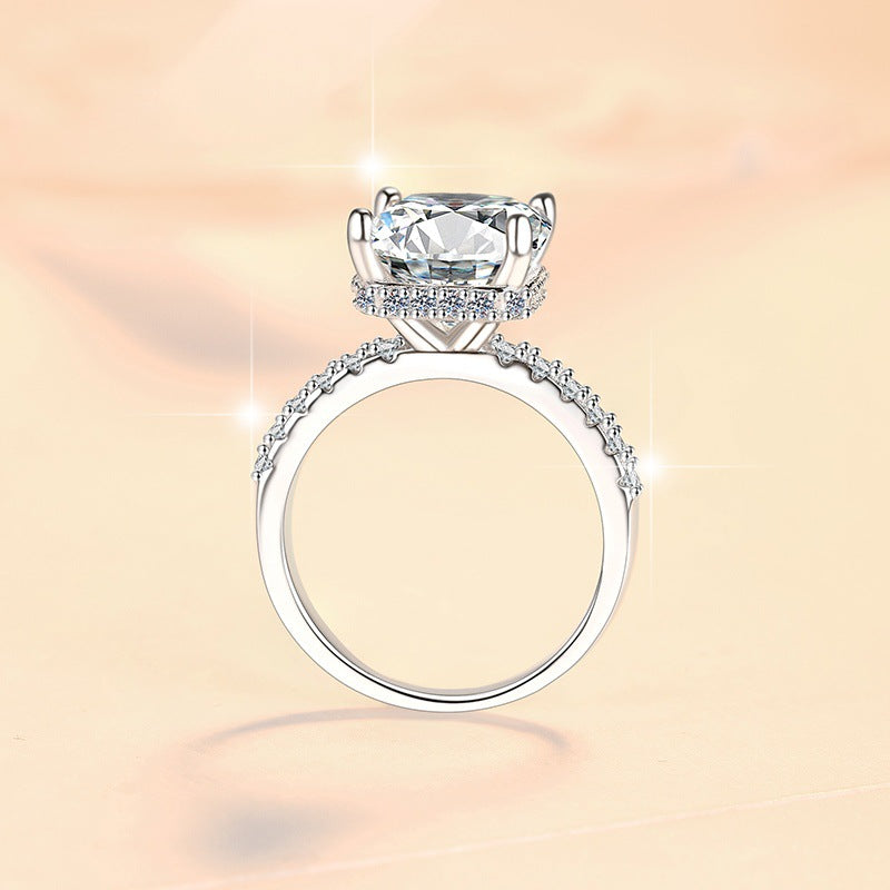 Damen Verlobungsring mit kunstvollem Zirkonia und elegantem Rahmen Shop Nory