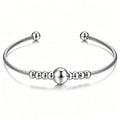 Damen Armreif mit elegantem Drahtdesign und funkelnden Kugeldetails Shop Nory