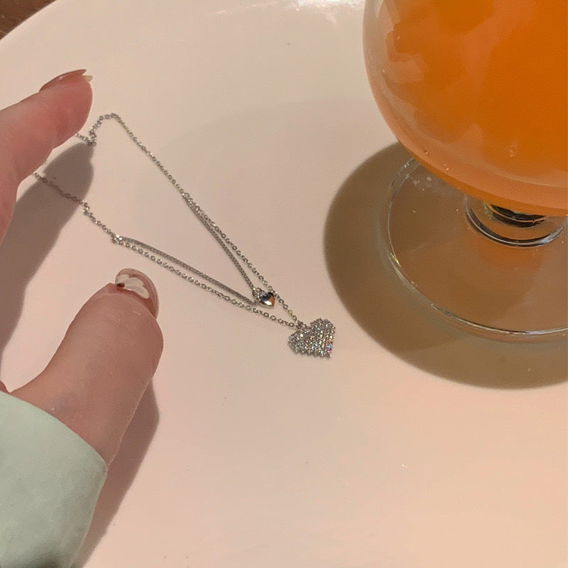 Damen Halskette mit doppeltem Herzanhänger und funkelnden Zirkonia Shop Nory