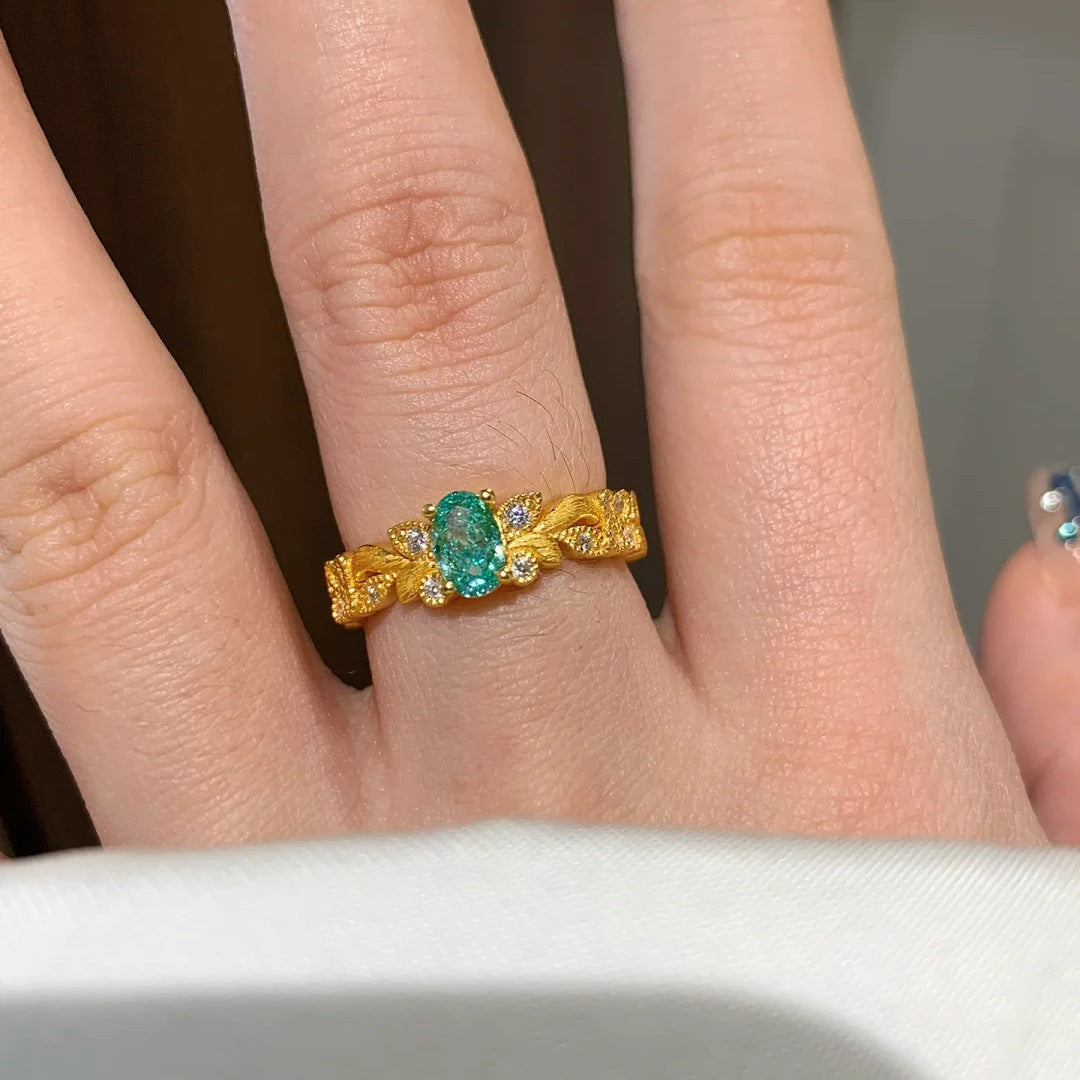 Damen eleganter Ring mit ovalem Edelstein und kunstvollen Zirkonia-Details Shop Nory