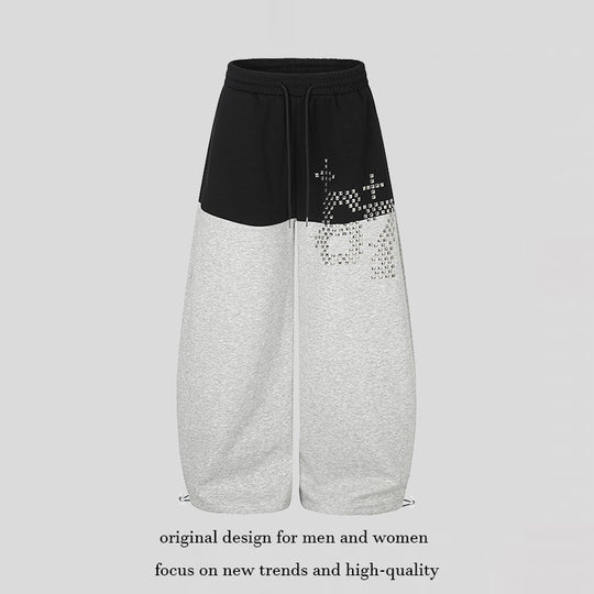 Damen Oversize Two‑Tone Palazzo‑Sweathose aus French Terry mit Logo‑Nieten, Tunnelzug und verstellbarem Saum Shop Nory