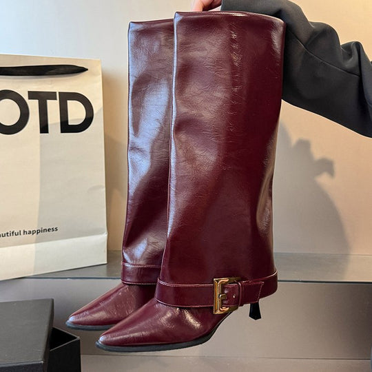 Damen Kniehohe spitz zulaufende Lederoptik-Stiefel mit schmaler Spitze und dekorativem Knöchelriemen Shop Nory