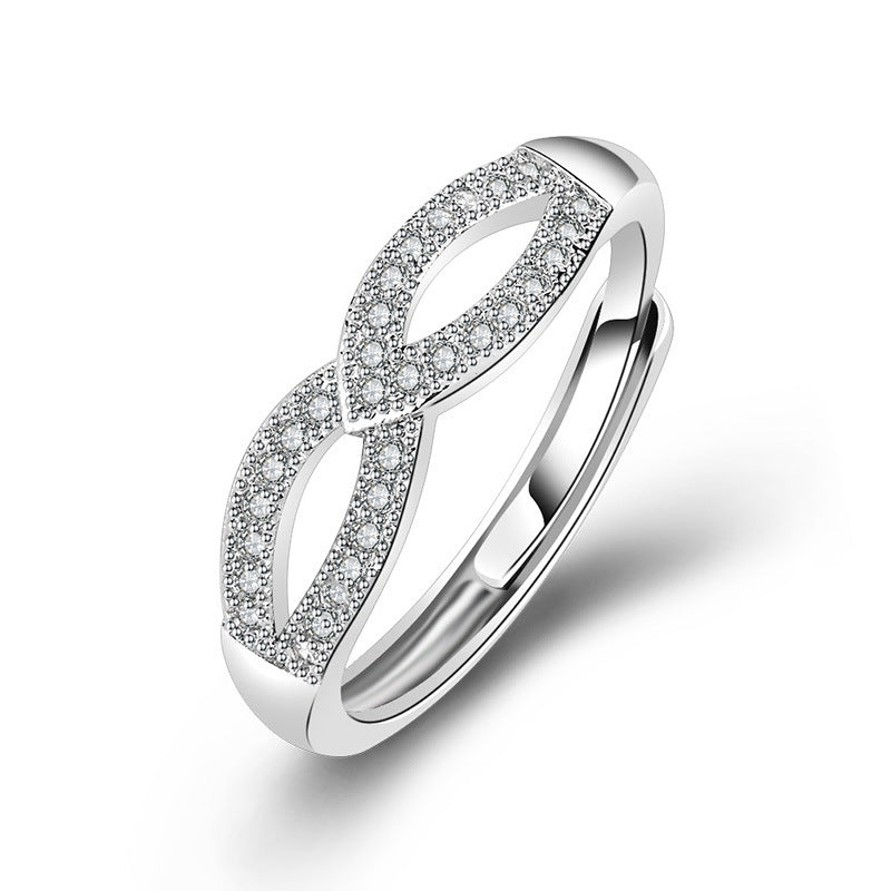 Damen filigraner Ring mit eleganter Schleifenstruktur und funkelndem Zirkonia Shop Nory
