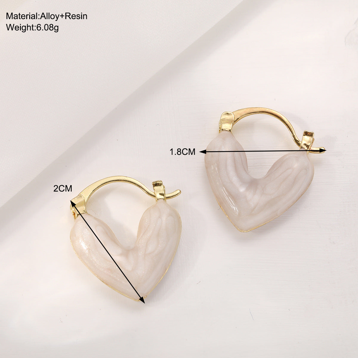 Damen Ohrstecker in Herzform mit elegantem Goldrahmen Shop Nory