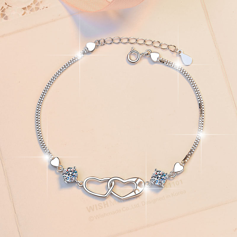 Damenarmband mit Herzdesign und funkelnden Kristallen Shop Nory