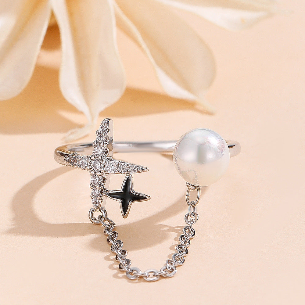 Damenring mit Perle und funkelnden Sternen Shop Nory