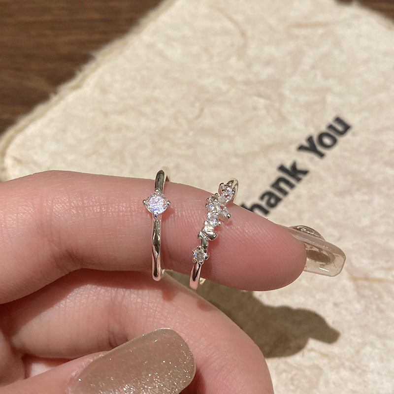 Damen eleganter Ring mit funkelnden Zirkonia und offenem Design Shop Nory