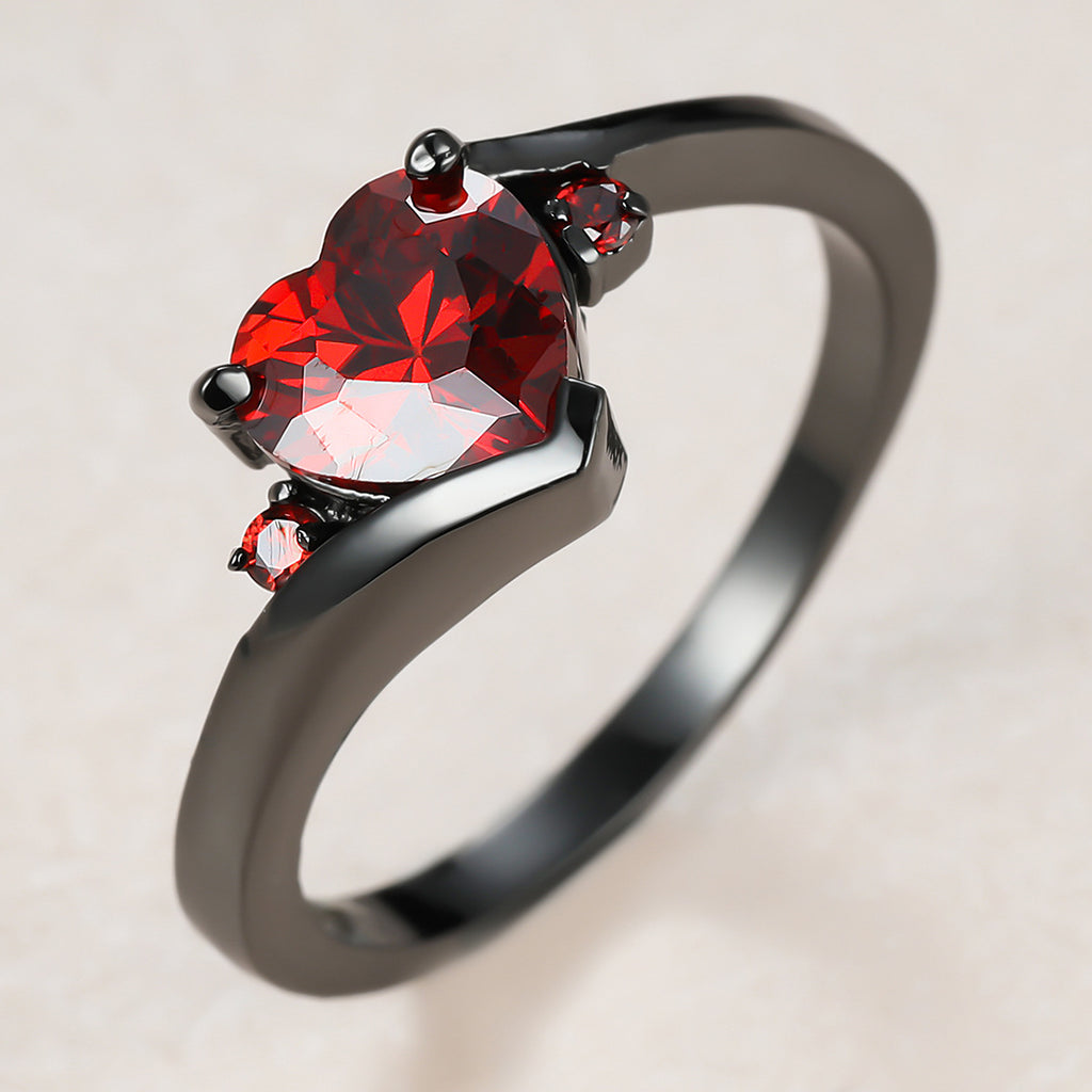 Damen Ring mit herzförmigem blauen Zirkonstein und eleganter schwarzer Fassung Shop Nory