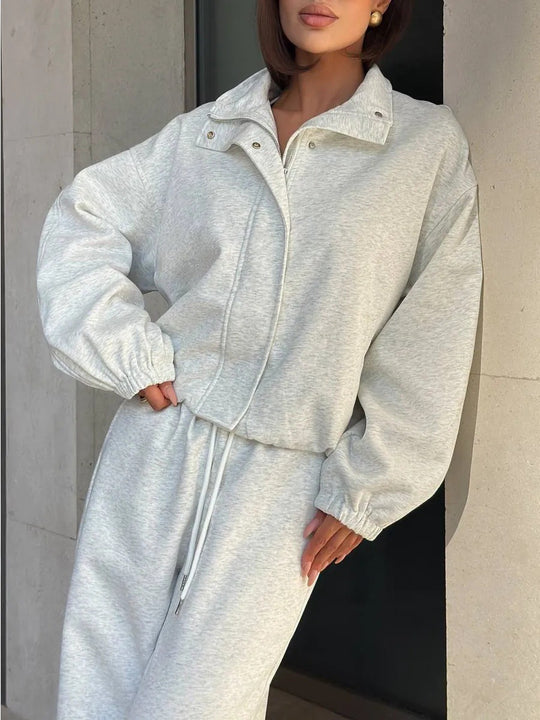 Damen gekürztes Reißverschluss-Hoodie mit Stehkragen und hochgeschnittener Kordel-Jogginghose Shop Nory