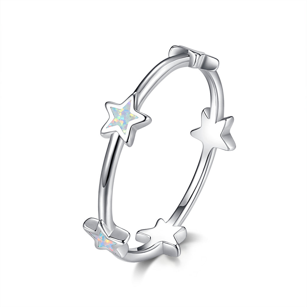 Damen Ring mit funkelnden Stern-Elementen und opalisierten Akzenten Shop Nory