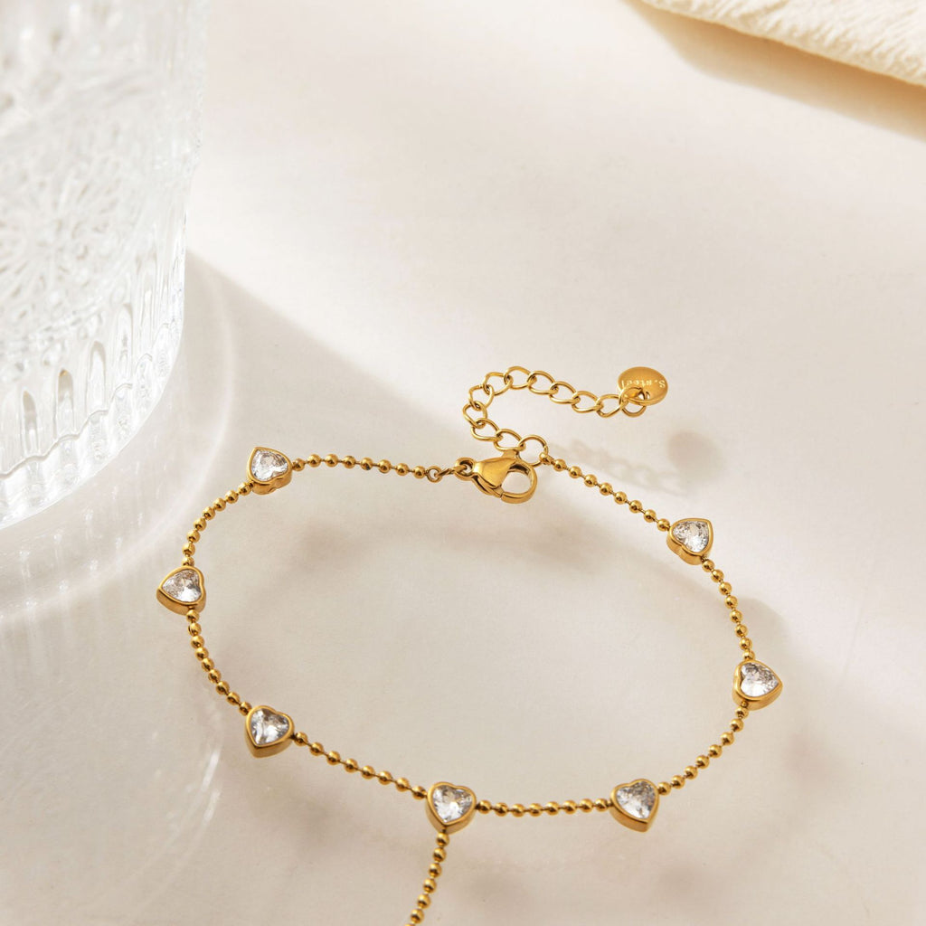 Damen Armband mit funkelnden Herzanhängern aus hypoallergenem Edelstahl Shop Nory