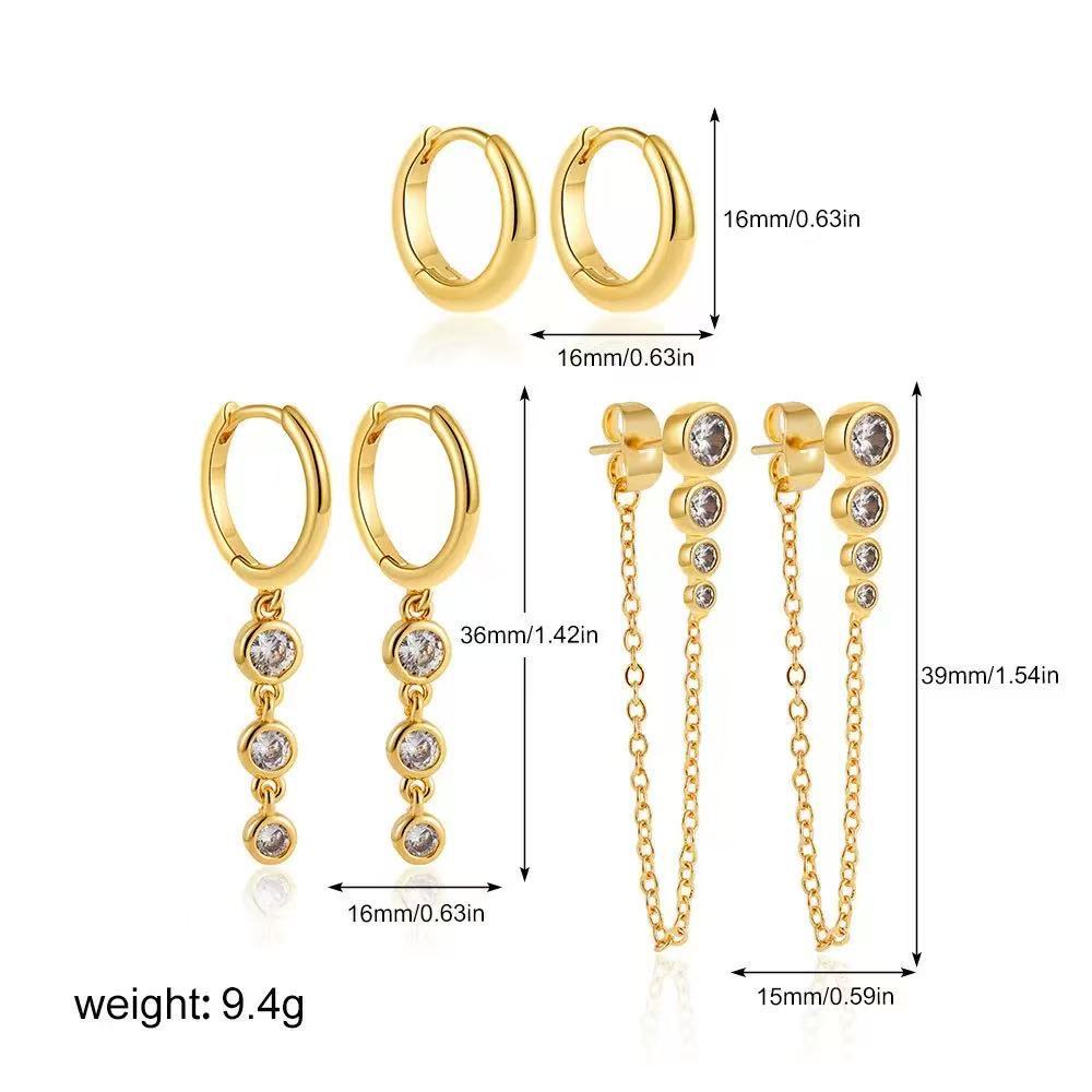 Damen Ohrringe mit funkelnden Zirkonia-Anhängern und zartem Kettendesign Shop Nory