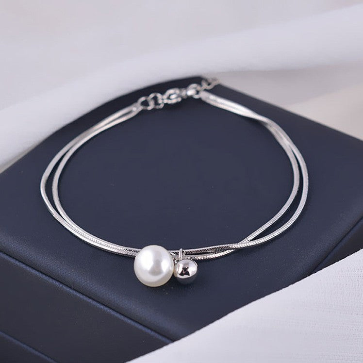 Damen elegantes Armband mit Perlenanhänger Shop Nory