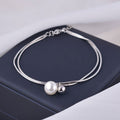 Damen elegantes Armband mit Perlenanhänger Shop Nory