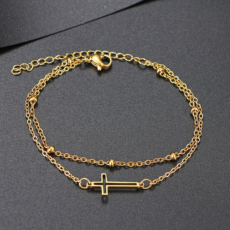 Damen Armband mit filigranem Kreuzdesign und elegantem Kettenspiel Shop Nory