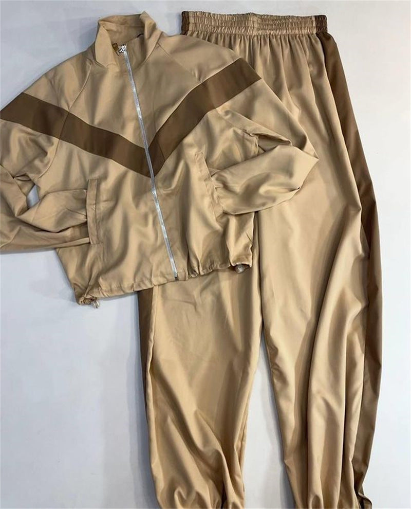 Damen tailliertes Zip-Trainingsset mit Chevron-Einsatz, Kordelzugsaum und hochgeschnittener Jogginghose Shop Nory