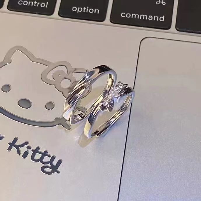 Damenring mit elegantem Schleifenmotiv und funkelnden Akzenten Shop Nory