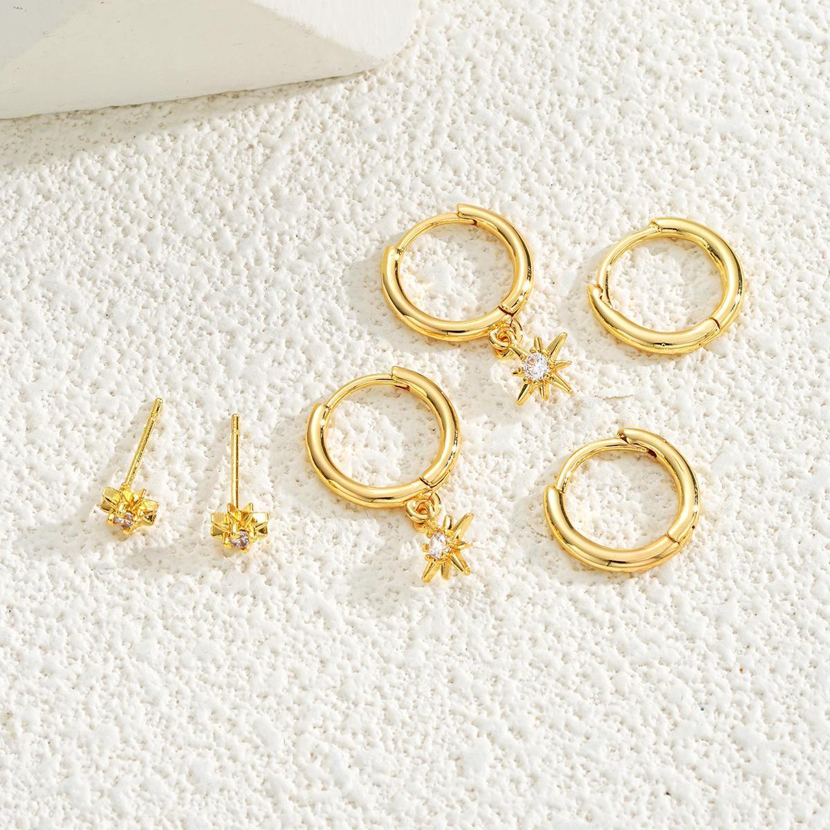 Damen Ohrschmuck mit funkelndem Sternanhänger und eleganten Creolen Shop Nory