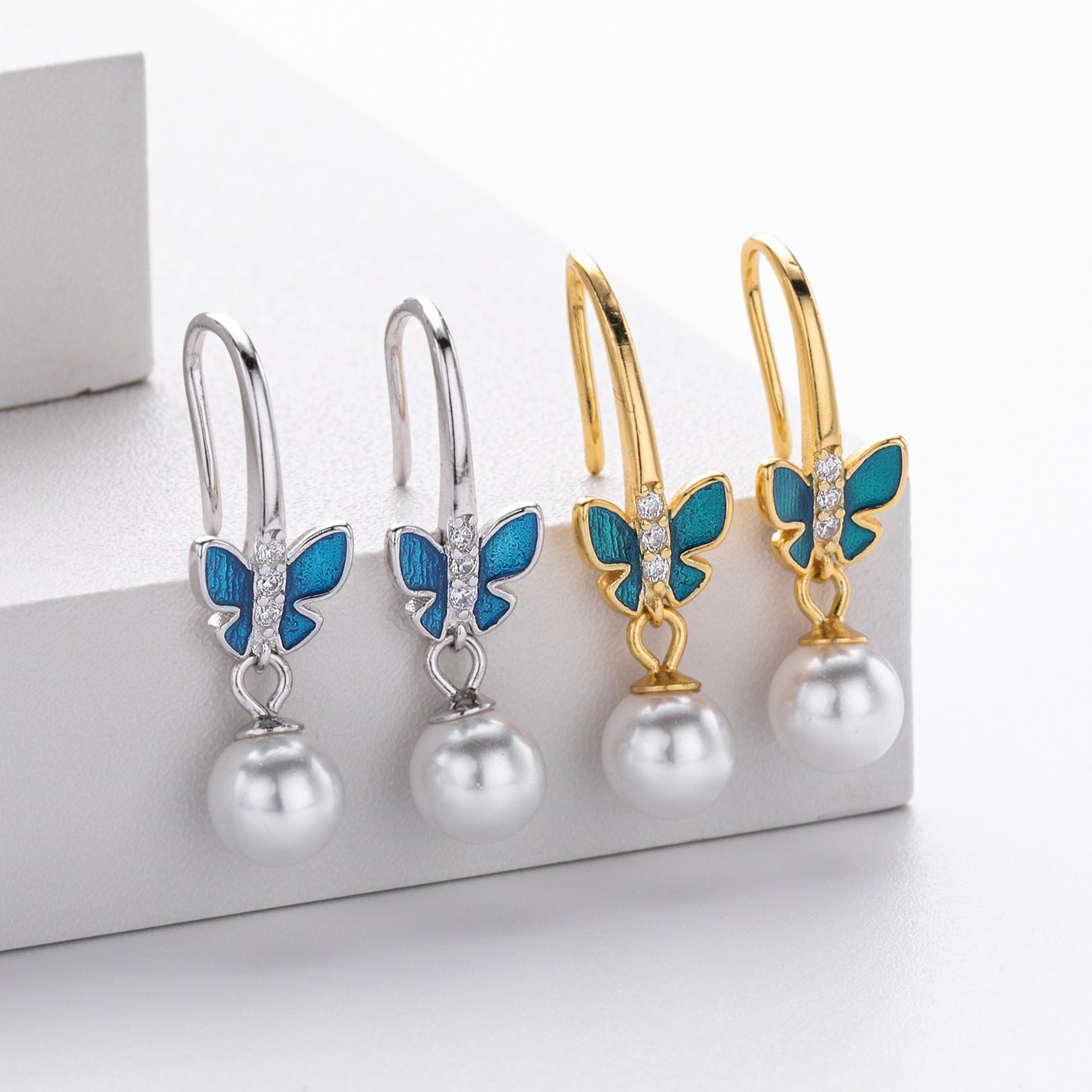 Damen Ohrhänger mit filigranem Schmetterlingsdesign aus hochwertigem 925 Sterling Silber und Perlenakzenten Shop Nory