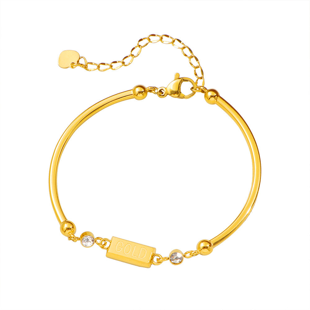 Damen Armband mit funkelnden Kristallakzenten und modernem GOLD-Anhänger Shop Nory