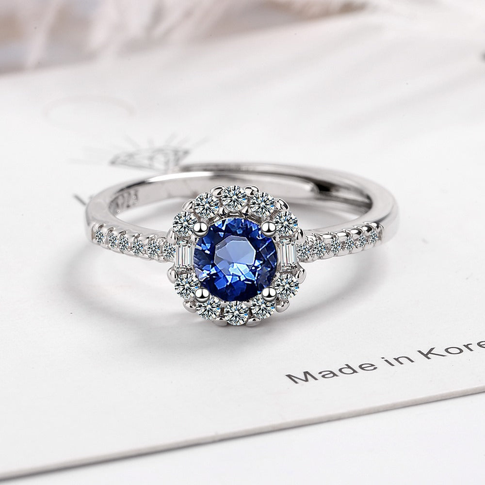 Damen Funkelnder Cocktailring mit blauen Zirkonia und detailreicher Fassung Shop Nory