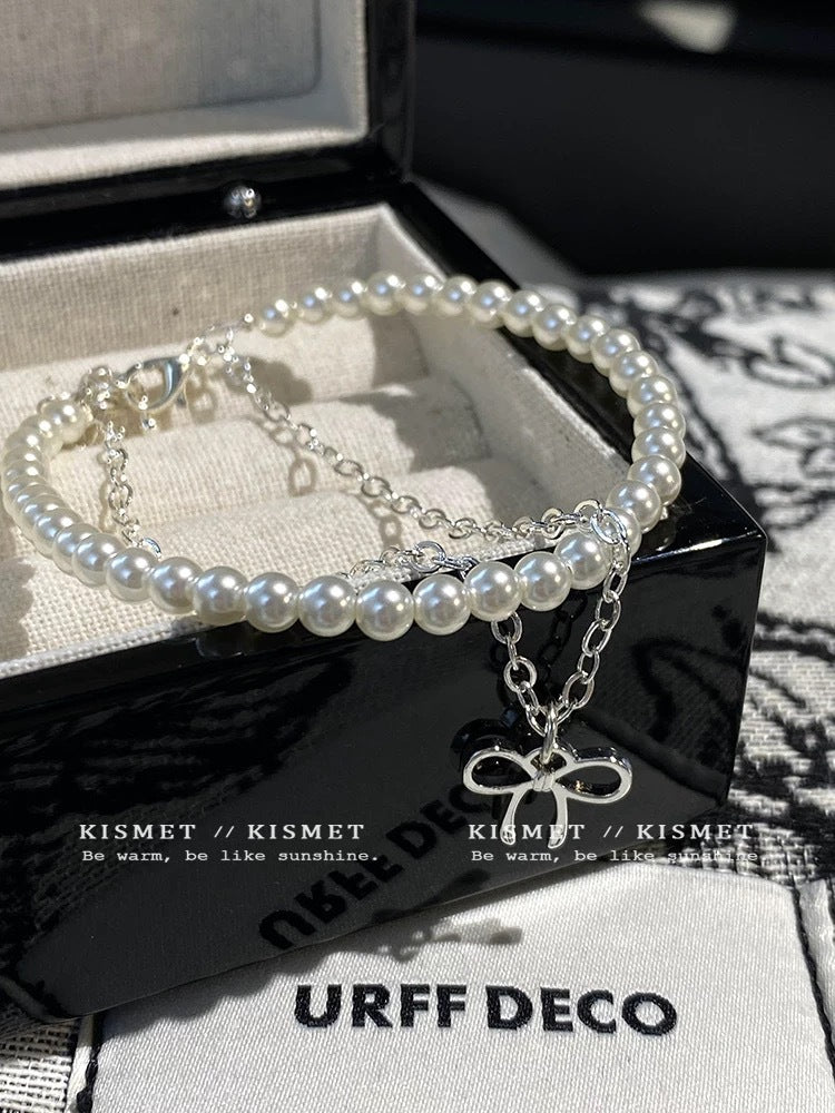 Damen Armband mit farbigen Halbedelsteinen und charmantem Schleifenanhänger Shop Nory
