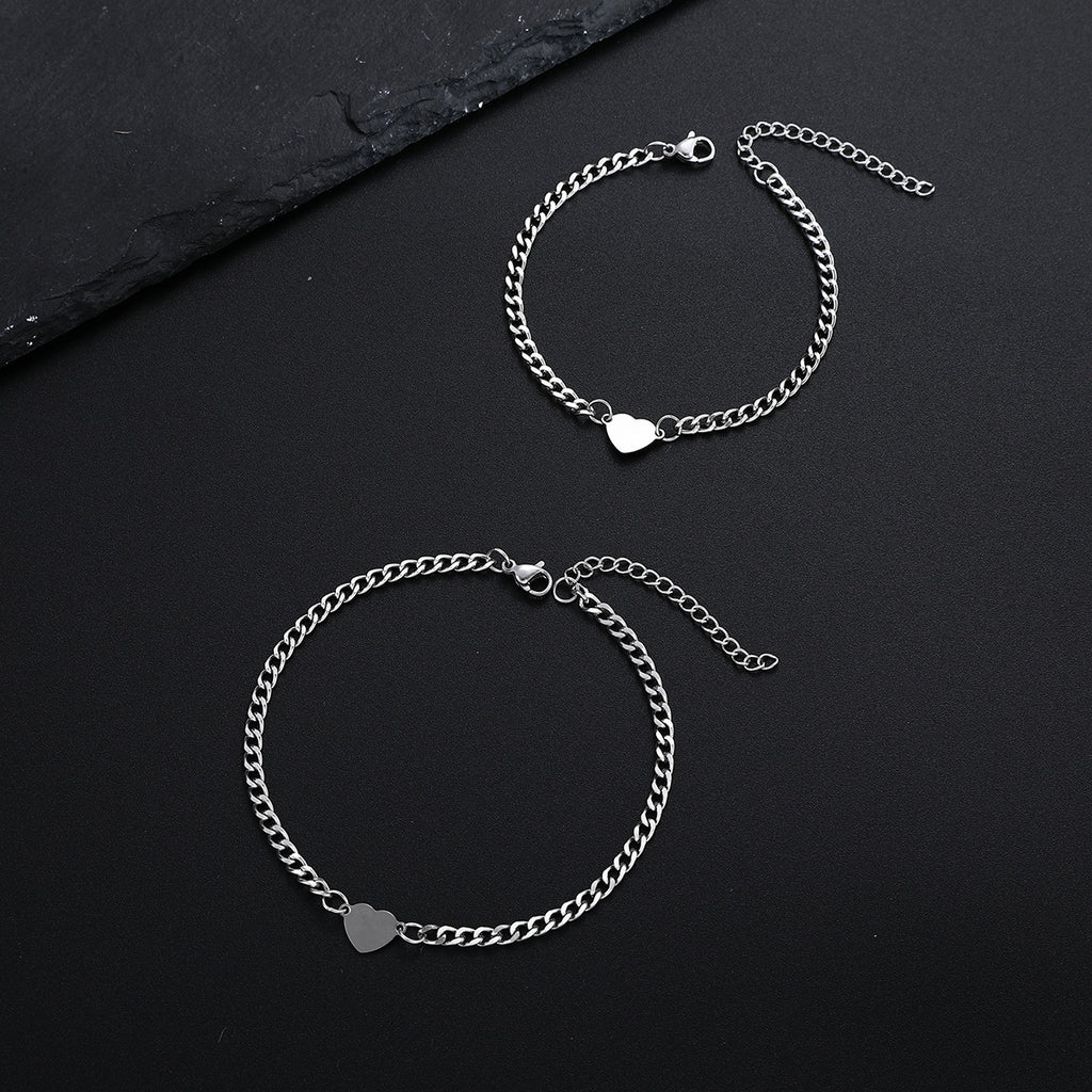 Damenarmband mit herzförmigen Anhängern und eleganter Gliederkette Shop Nory