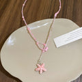 Damen Kette mit handgefertigtem Blumenanhänger Shop Nory
