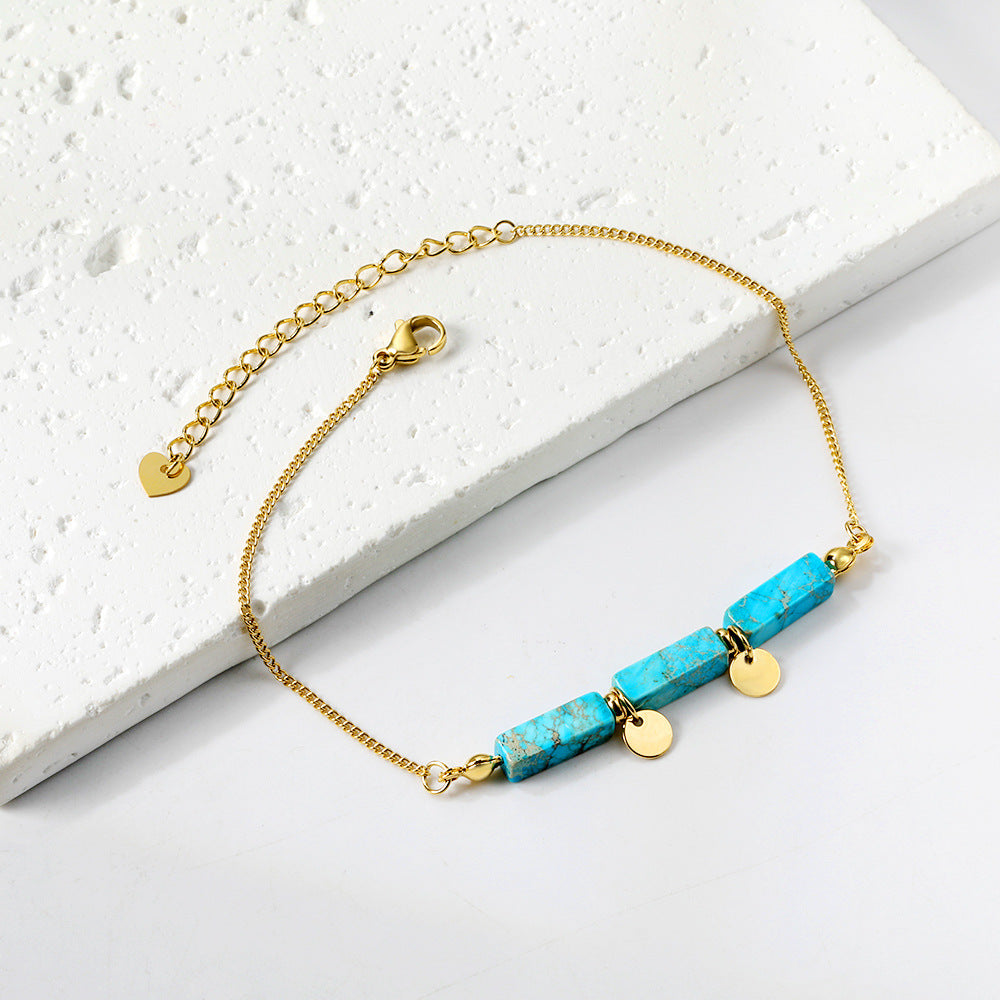 Damen Armband mit funkelnden Karibikstein-Elementen aus hochwertigem Edelstahl und goldplattierten Akzenten Shop Nory