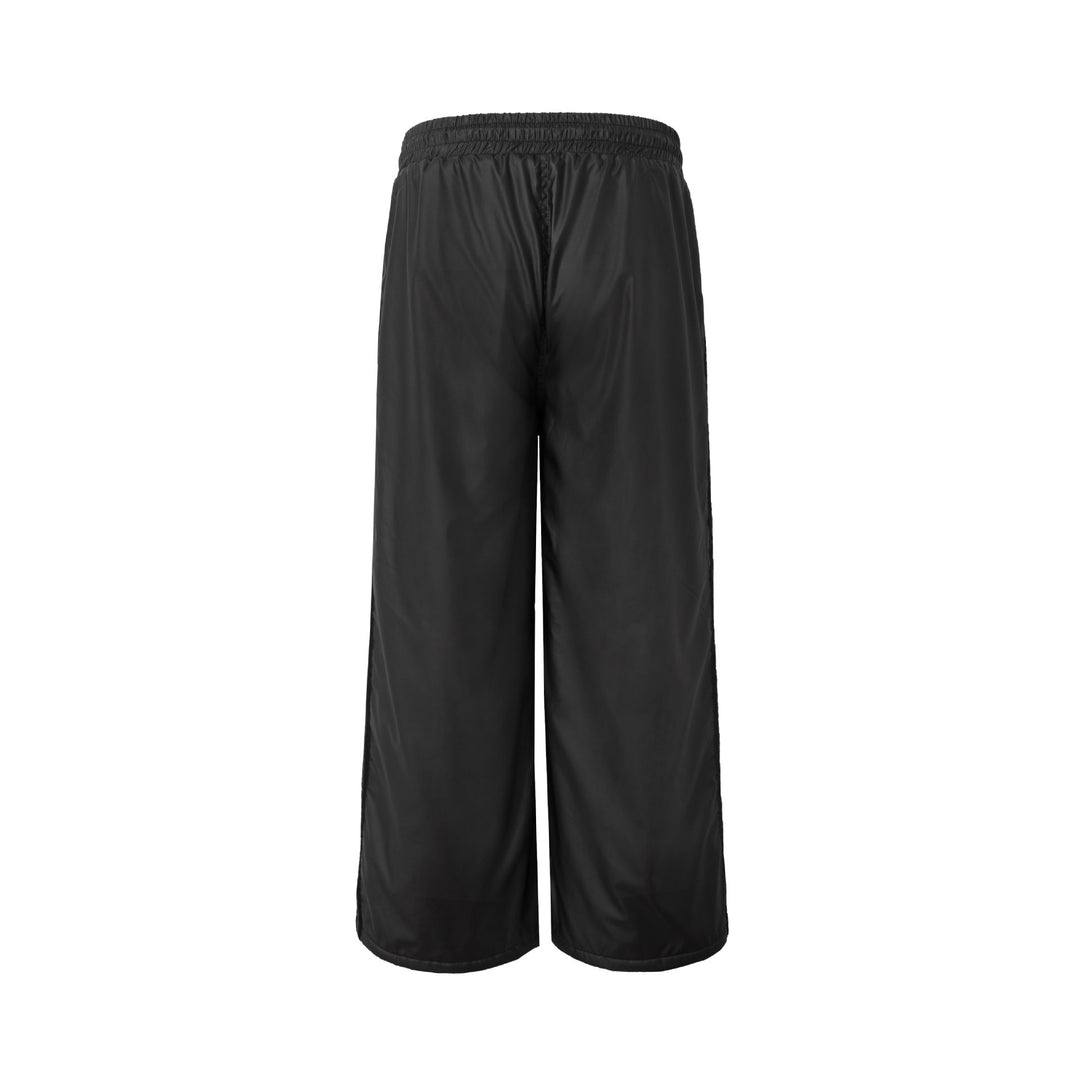 Unisex Weite technische Nylon-Trainingshose mit elastischem Tunnelzug und seitlichen Einsatzstreifen Shop Nory