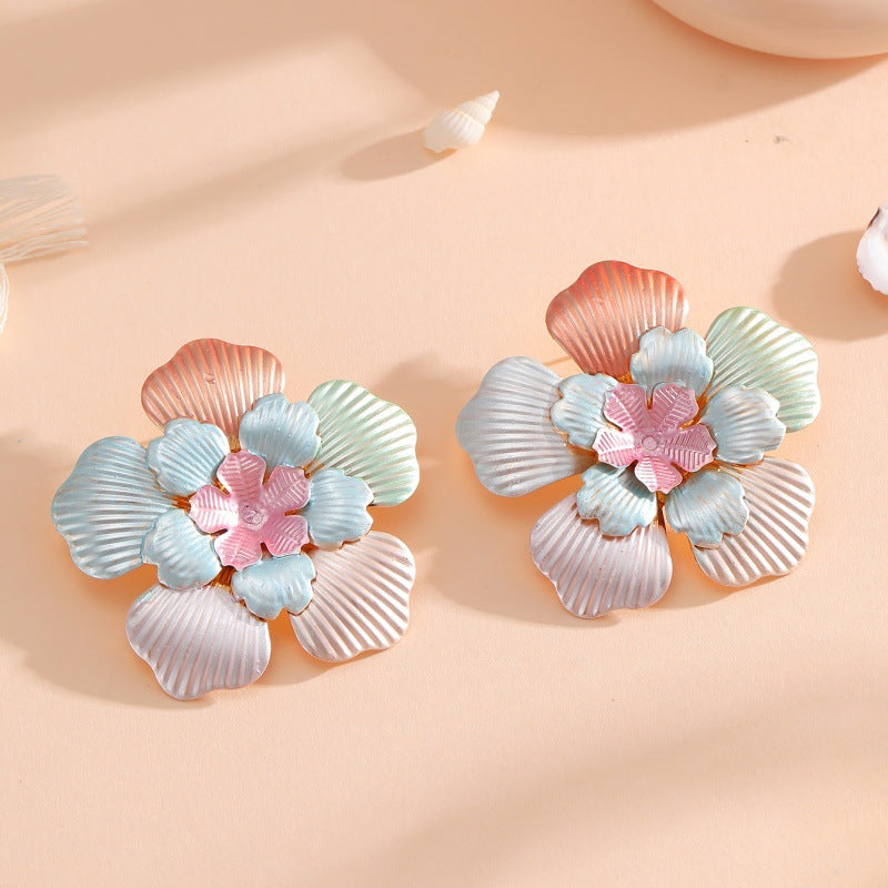 Damen Blumenohrringe mit filigranem Design und glänzenden Akzenten Shop Nory