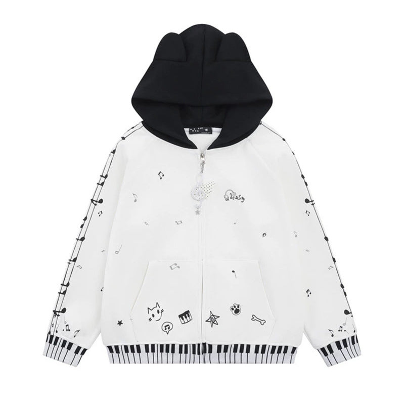 Damen Kapuzensweatjacke mit durchgehendem Reißverschluss, Musikprint, Klaviertasten‑Bündchen und Ohrenkapuze Shop Nory