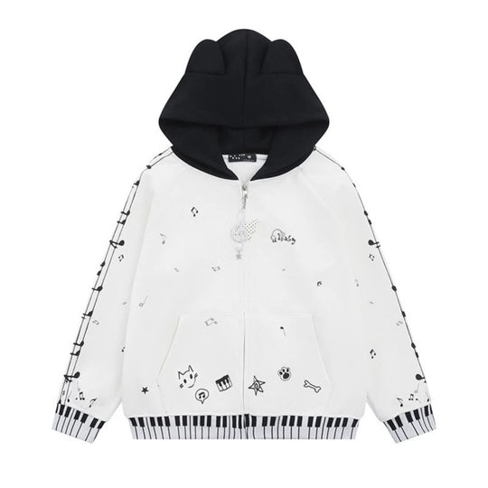Damen Kapuzensweatjacke mit durchgehendem Reißverschluss, Musikprint, Klaviertasten‑Bündchen und Ohrenkapuze Shop Nory
