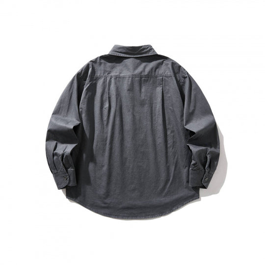 Unisex Oversize-Denim-Hemdjacke mit kastiger Silhouette, Brusttasche und gerundetem Saum Shop Nory