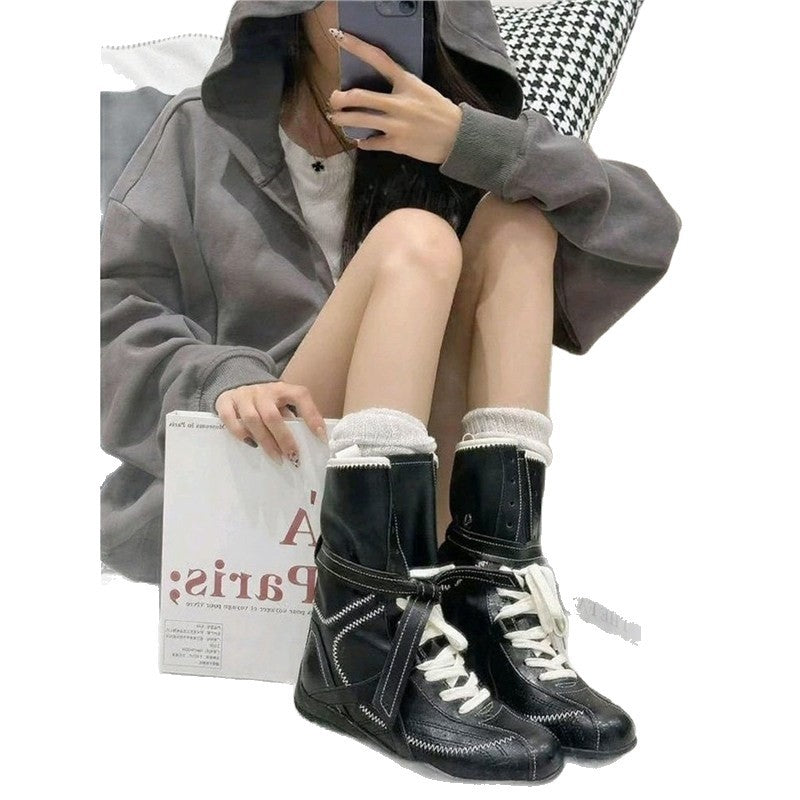 Damen Schnür-Ankleboots mit dekorativer Ziernaht, Riemenverschluss und markanter Profilsohle Shop Nory
