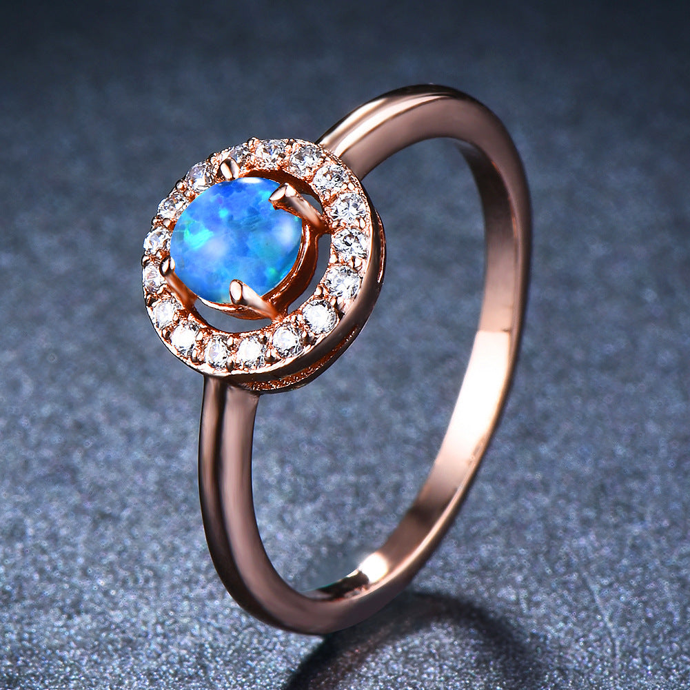 Damen Ring mit schimmerndem Opal und funkelnden Zirkoniastein-Verzierungen Shop Nory