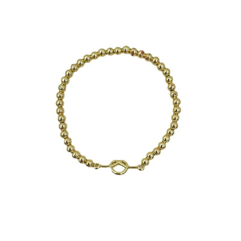 Damen Armband aus feinen, goldfarbenen Kugelperlen Shop Nory