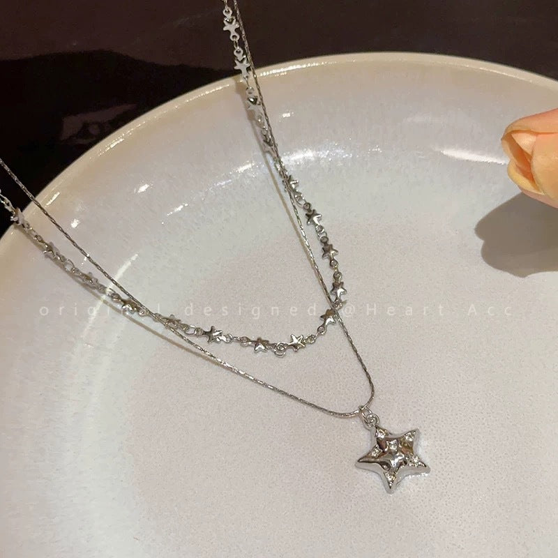 Damen Halskette mit funkelndem Sternanhänger und eleganter Gliederkette Shop Nory