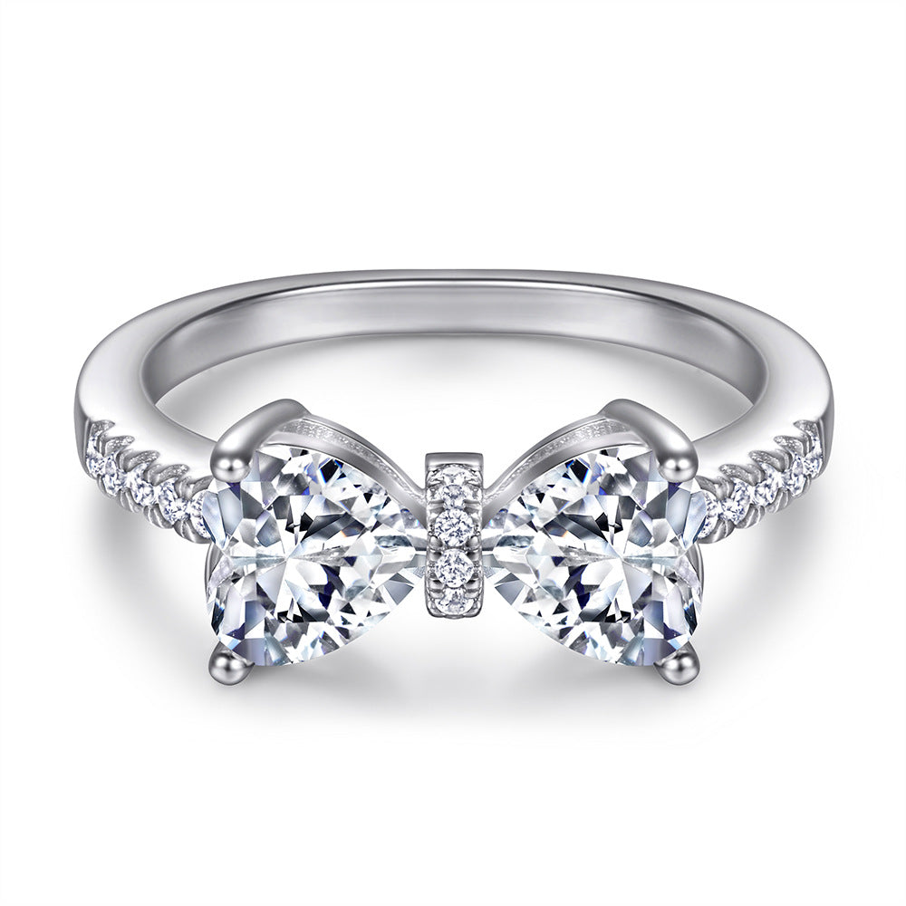 Damen Designer-Ring mit Schleifenmotiv und funkelnden Zirkonia Shop Nory